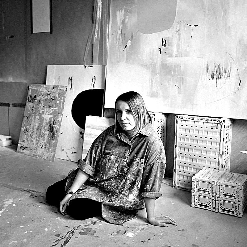 Black-and-white portrait of abstract painter Anastasia Sawall in her Flensburg studio